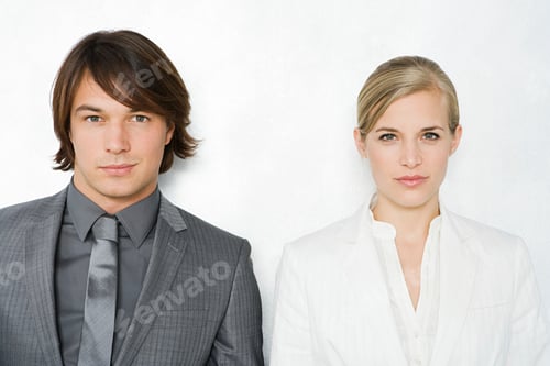 Preview: Two professionals in smart attire against a white background