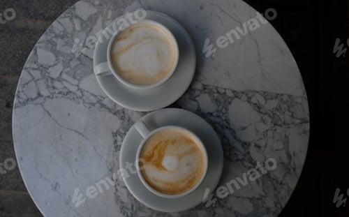 Preview: Two Cups of Cappuccino on Marble Table