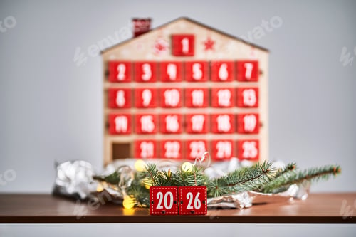 Preview: Christmas Advent calendar in the shape of a house with boxes making up the number 2026.