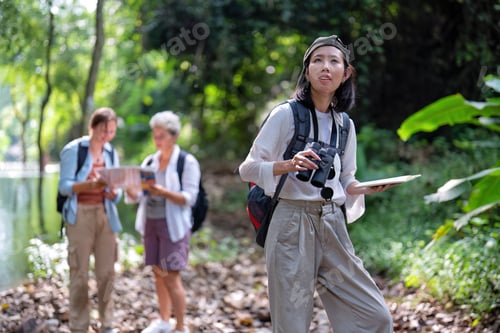 Preview: Backpack tourist travel outdoor adventure bird study using binoculars looking and record to book