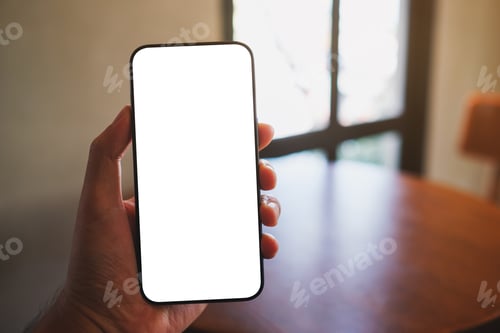 Preview: Mockup image of a man holding mobile phone with blank white screen in cafe