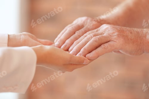 Preview: Young woman holding elderly man hands indoors, closeup. Help service