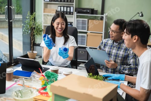 Preview: Business people working examining waste recyclable separation divided bin in the office