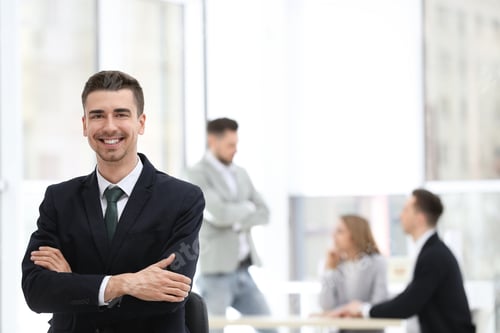 Preview: Portrait of handsome young businessman in office