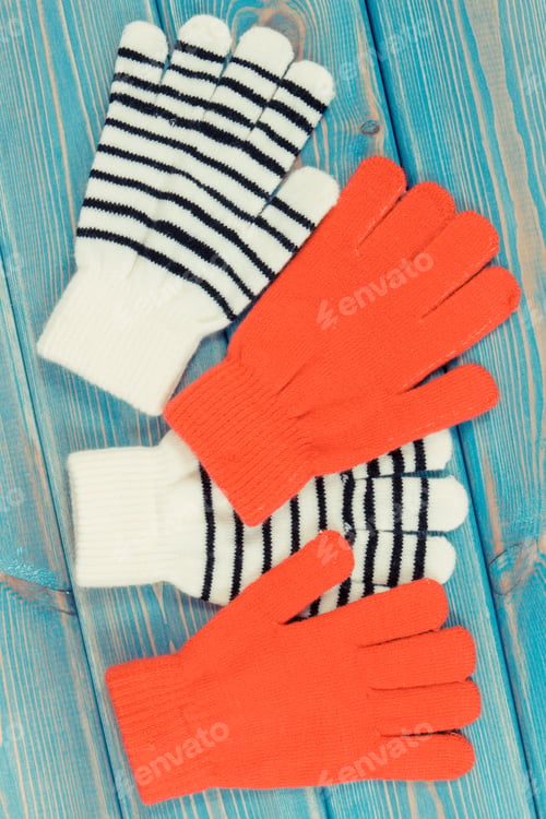 Preview: Colorful gloves for woman on boards, clothing for autumn or winter concept