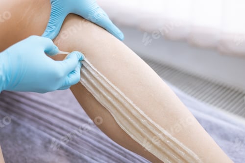 Preview: female legs hair removal with sugaring procedure in beauty salon