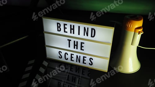 Preview: Behind the scenes light box. Text on cinema light box.