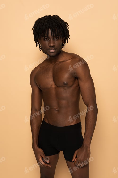 Preview: shirtless sexy muscular african american man on beige