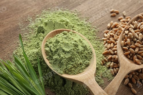 Preview: Spoons of wheat grass powder and grains with sprouts on wooden table