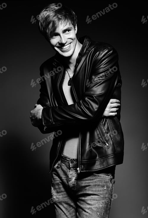 Preview: Portrait of young handsome man posing in studio