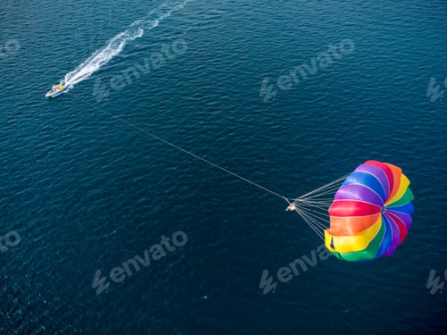 Preview: Aerial view of the boat and parachute in the sea resort