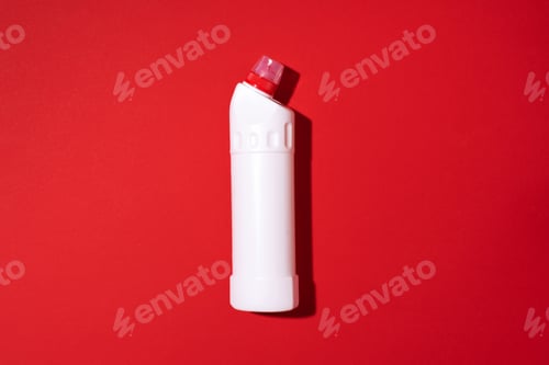 Preview: White plastic bottle of cleaning product, household chemicals or liquid laundry detergent on red