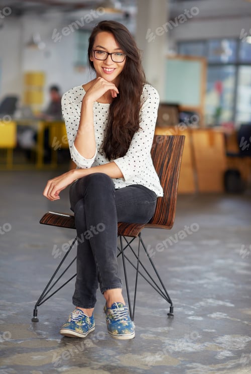 Preview: Shes the consummate young professional. Portrait of an attractive young woman sitting in an office.