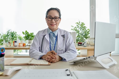 Preview: Doctor sitting at her workplace at office