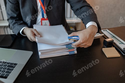 Preview: an accounting and financial officer is working on documents in the office
