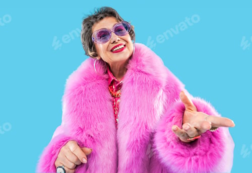 Preview: Happy and funny senior old woman on colorful background