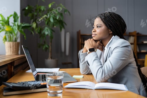 Preview: Distracted from work businesswoman at office desk with laptop look in window pensive about problem