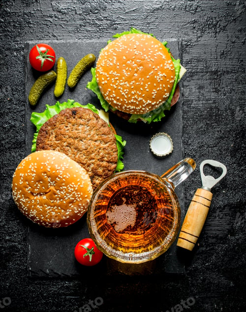 Preview: Burgers and beer in a glass.