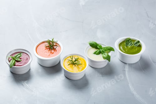 Preview: Set of seasonal fall autumn creamy soups on a table
