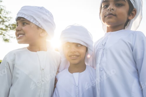 Preview: children playing together in Dubai in the park.