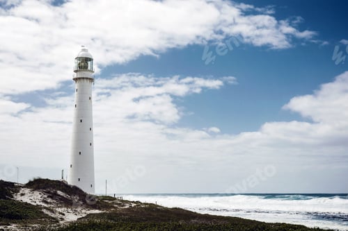 Preview: Lighthouse on a rugged coastline with a vintage look