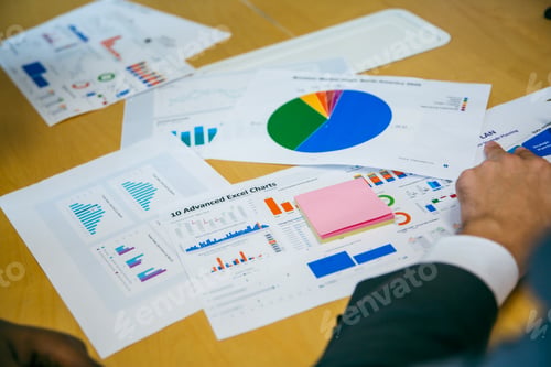 Vista previa: business team meeting with stats and review graphs of company target goals market research