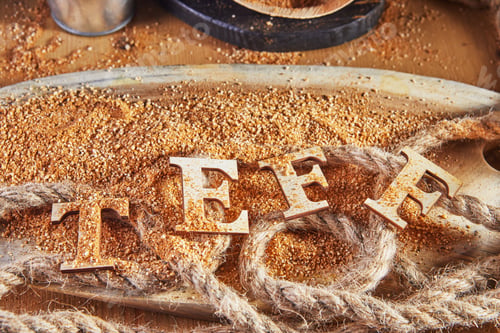Preview: Teff, an alternative to ancient gluten-free grain with the name written in wooden letters.