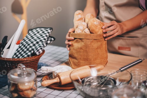 Preview: Close up hand of bakery shop owner holding homemade bakery , SME small business concept