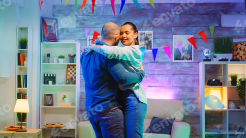 Preview: Attractive young couple dancing on romantic music