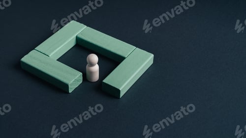 Vista previa: Wooden figure inside green square structure concept of protection barrier safety isolation