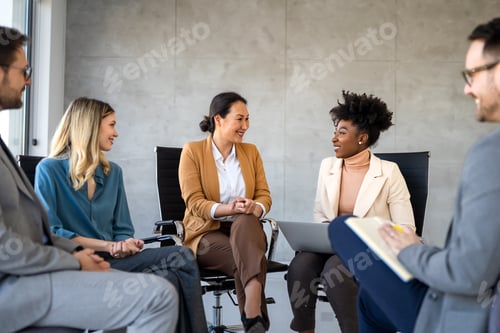 Preview: Diverse business people sitting in circle at group therapy session. Business coach training staff