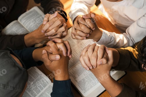 Preview: People Gathered in Prayer Around an Open Book