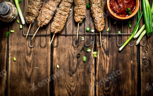 Preview: Kebab with tomato sauce and green onions.