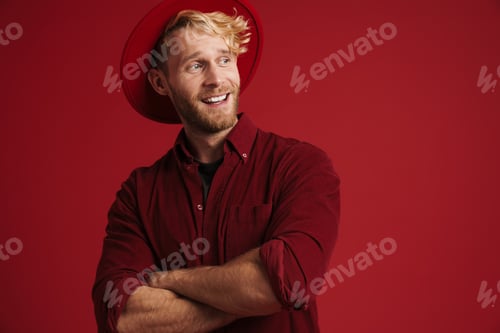 Preview: White bearded man looking at camera while posing with arms crossed