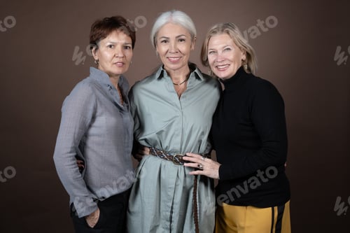 Preview: Three Stylish Women Posing Together in Studio