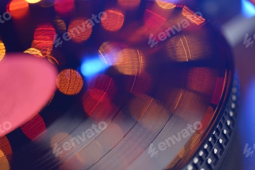 Preview: Vinyl player LP record with blured or defocused lights.
