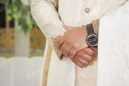 Preview: Elegant attire and stylish watch in formal setting