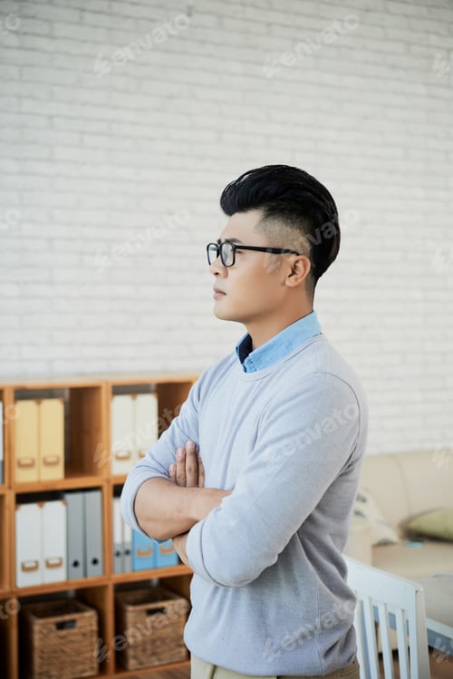 Preview: Confident Asian businessman in office