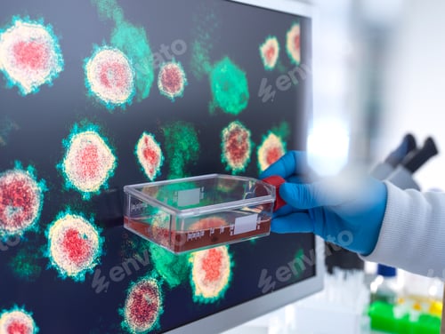 Preview: Scientist examining a petri dish with virus cells displayed in the background.
