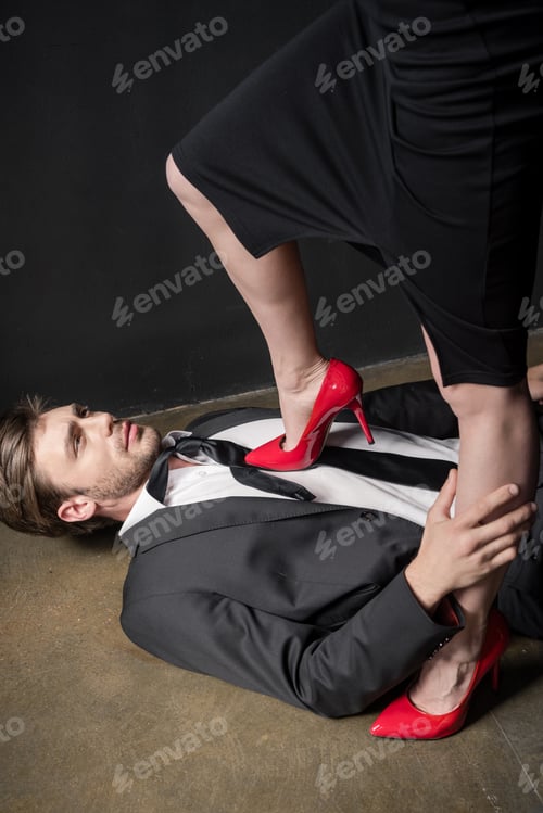Preview: girl in red stilettos dominating on young elegant man in sexual scene