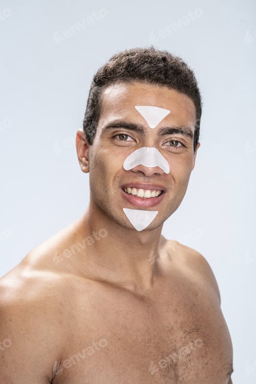 Preview: Man smiling waiting for the end of beauty procedures