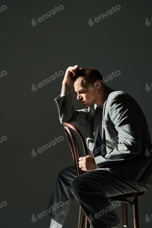 Preview: A Man in a Suit, Pondering in the Shadows