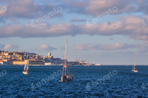 Preview: View of Lisbon view over Tagus river with yachts and boats on sunset. Lisbon, Portugal