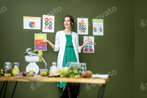 Preview: Portrait of a woman dietitian with schemes on the topic of nutrition