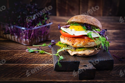 Preview: Sandwich with chicken burger, tomatoes, pickled cucumber and fried egg