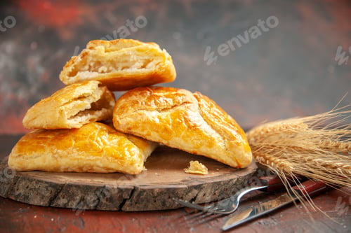 Preview: front view penovani khachapuri on wood board knife and fork on dark red background