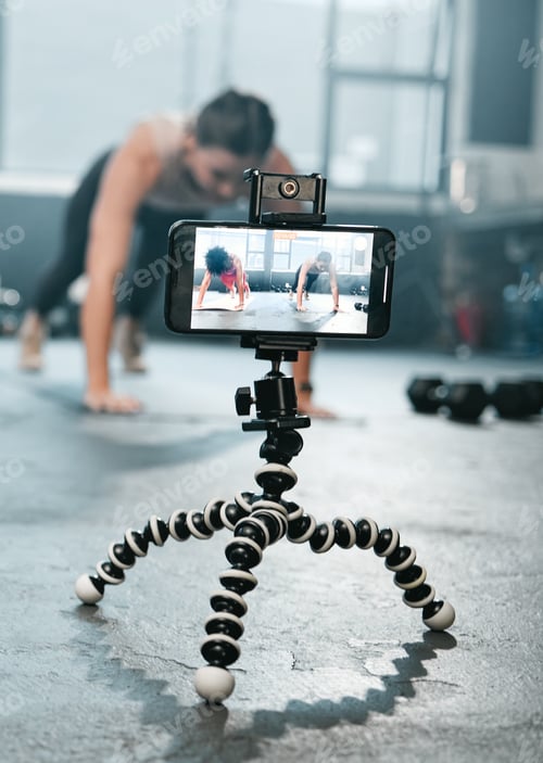 Preview: Influencer, phone and fitness women recording, filming or broadcast online training video, exercise