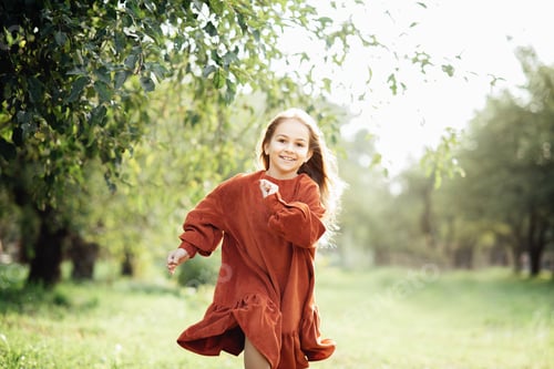 Preview: Child whirling, dancing plays on meadow. Girl having fun at nature