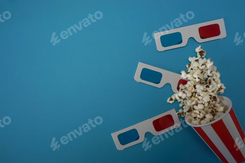 Preview: Retro shot of 3D glasses and popcorn on a blue background
