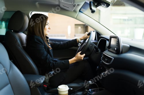 Preview: Side view of a professional woman driving to work
